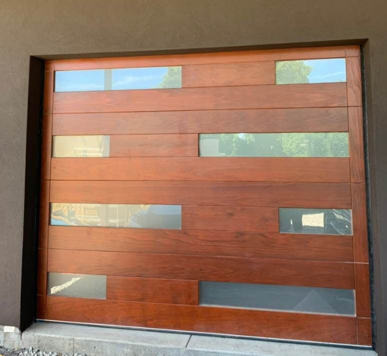 professional technicians from Fort Lauderdale FL Garage Door Repair Services expertly repairing a residential garage door.