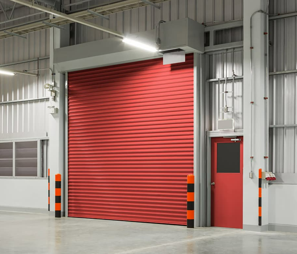Commercial garage door repair service in Fort Lauderdale, FL, showcasing expert technicians fixing an industrial garage door, enhancing security and functionality for businesses.