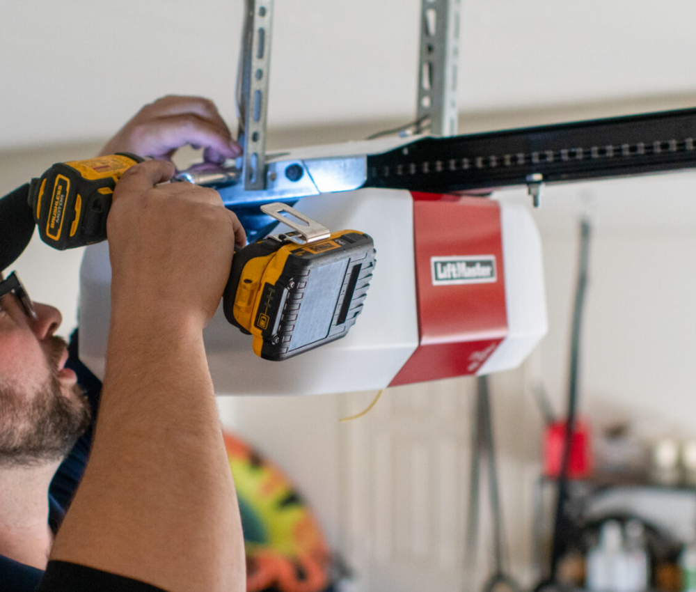 a technician repairing a garage door opener in Fort Lauderdale, FL.