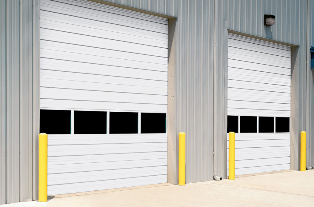 A professional technician performing commercial garage door repair services in Fort Lauderdale, FL, ensuring smooth operation and enhanced security for business premises. Expert garage door solutions tailored for commercial needs.