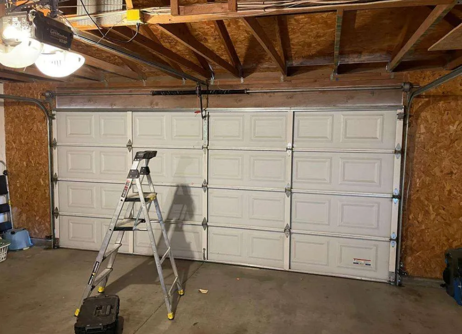 a professional technician repairing a residential garage door in Fort Lauderdale, emphasizing local garage door repair services.