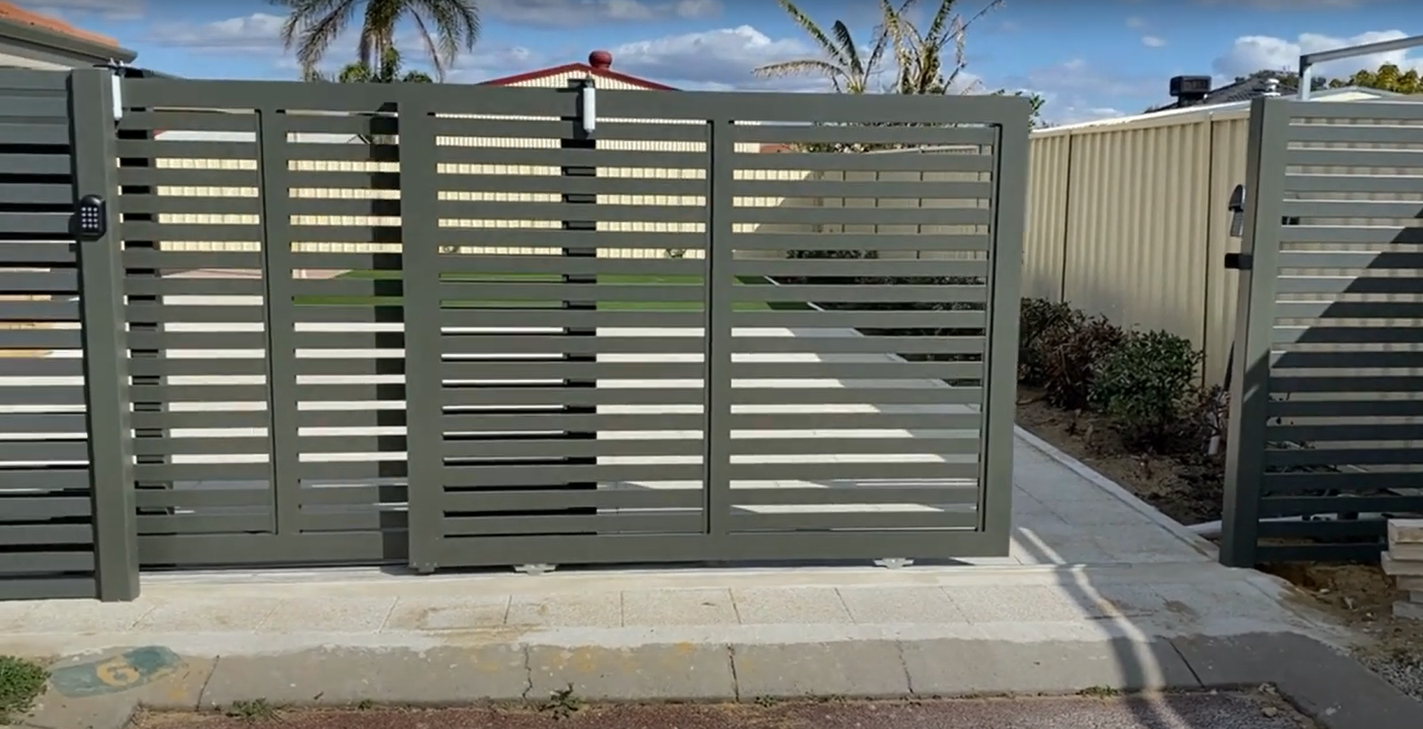 Professional gate repair services in Fort Lauderdale, FL - Expert technicians fixing a residential gate with precision and care at Fort Lauderdale FL Garage Door Repair Services